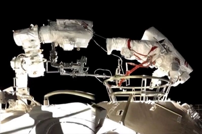 Chinese astronauts conduct first spacewalk outside new space station | Chinese astronauts conduct first spacewalk outside new space station