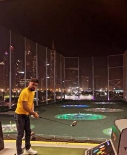 Rashid Khan plays the 'helicopter' with a golf club in UAE; video goes viral | Rashid Khan plays the 'helicopter' with a golf club in UAE; video goes viral