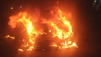 Delhi: Car turns into fireball on BRT track, driver hurt | Delhi: Car turns into fireball on BRT track, driver hurt