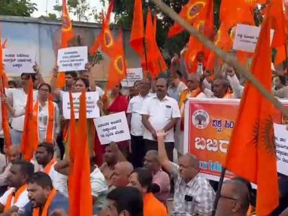 VHP stages protest in K'taka over proposal to withdraw anti-conversion law | VHP stages protest in K'taka over proposal to withdraw anti-conversion law