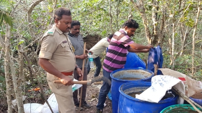 Andhra cops destroy 62.9K Lt jaggery wash in election crackdown | Andhra cops destroy 62.9K Lt jaggery wash in election crackdown