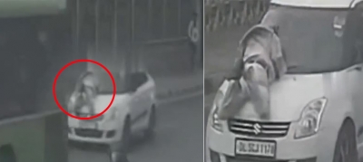 Man dragged on car's bonnet in Delhi for half-a-kilometre | Man dragged on car's bonnet in Delhi for half-a-kilometre