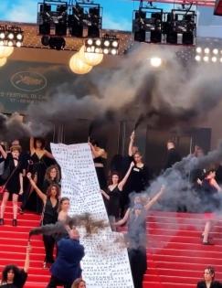 Women protesters storm Cannes premiere of 'Holy Spider' with smoke devices | Women protesters storm Cannes premiere of 'Holy Spider' with smoke devices