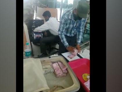 Customs officer, wife held at Bengaluru airport with Rs 75 lakh in hand baggage | Customs officer, wife held at Bengaluru airport with Rs 75 lakh in hand baggage