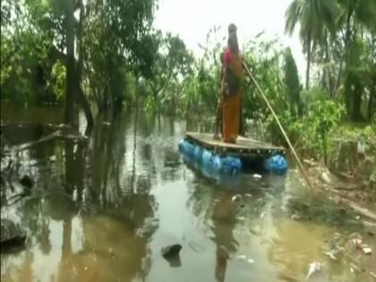 Cyclone Yaas: Villagers use rafts to commute in submerged villages of WB's East Midnapore | Cyclone Yaas: Villagers use rafts to commute in submerged villages of WB's East Midnapore