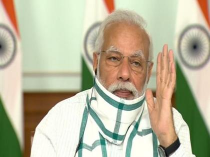 PM Modi sticks to trusted 'gamcha' mask | PM Modi sticks to trusted 'gamcha' mask