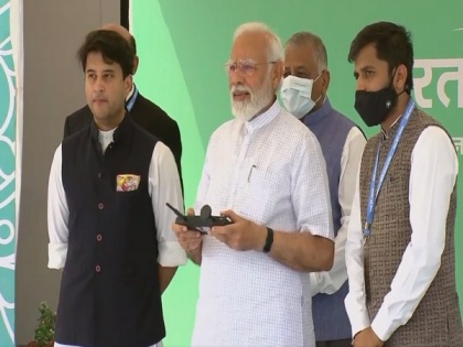 Delhi: PM Modi flies drone during inauguration of two-day 'Bharat Drone Mahotsav' | Delhi: PM Modi flies drone during inauguration of two-day 'Bharat Drone Mahotsav'