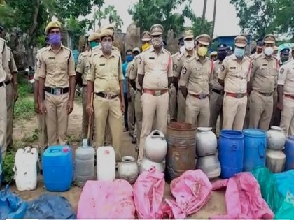 Andhra police destroys 2,000 litres of country liquor, 10,000 litres of jaggery wash | Andhra police destroys 2,000 litres of country liquor, 10,000 litres of jaggery wash