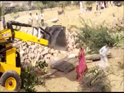 Video shows JCB machine mowing down woman in Rajasthan's Barmer, 2 FIRs registered | Video shows JCB machine mowing down woman in Rajasthan's Barmer, 2 FIRs registered Video shows JCB machine mowing down woman in Rajasthan's Barmer, 2 FIRs registered | Video shows JCB machine mowing down woman in Rajasthan's Barmer, 2 FIRs registered