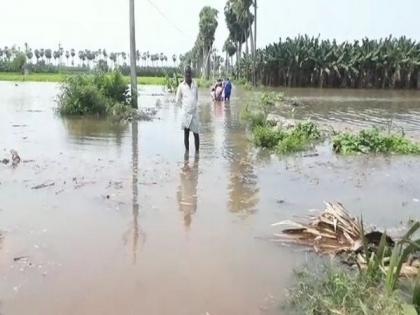 Couple rescued by fire fighters from flooded Andhra village | Couple rescued by fire fighters from flooded Andhra village