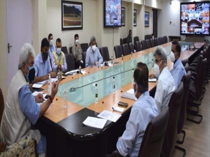 J-K Lt Governor reviews COVID-19 containment measures, directs officials to vaccinate 45+ age group by June end | J-K Lt Governor reviews COVID-19 containment measures, directs officials to vaccinate 45+ age group by June end
