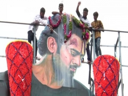 To celebrate 'Saaho' release, Prabhas fans pour milk on actor's cutout | To celebrate 'Saaho' release, Prabhas fans pour milk on actor's cutout