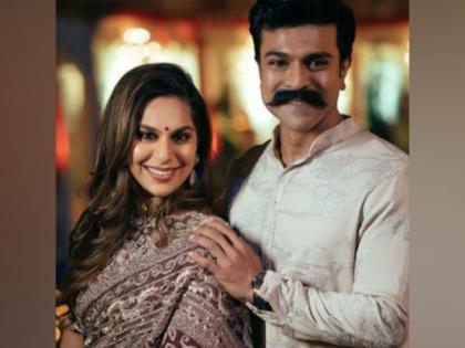 Ram Charan's wife Upasana happily throws confetti at a theatre screen while watching 'RRR' | Ram Charan's wife Upasana happily throws confetti at a theatre screen while watching 'RRR'