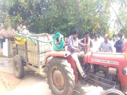 Andhra minister drives tractor that sprays sodium hypochlorite in Krishna | Andhra minister drives tractor that sprays sodium hypochlorite in Krishna