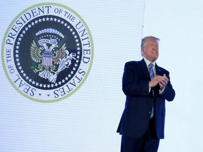 Trump appears on stage with doctored Presidential seal referencing Russia projected on screen | Trump appears on stage with doctored Presidential seal referencing Russia projected on screen