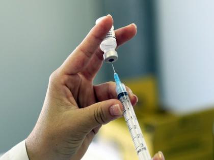 Japan to reduce vaccine gap for booster jabs 'wherever possible' | Japan to reduce vaccine gap for booster jabs 'wherever possible'