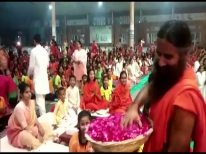May colours of yoga, spirituality prevail: Ramdev celebrates Holi with flowers in Haridwar | May colours of yoga, spirituality prevail: Ramdev celebrates Holi with flowers in Haridwar