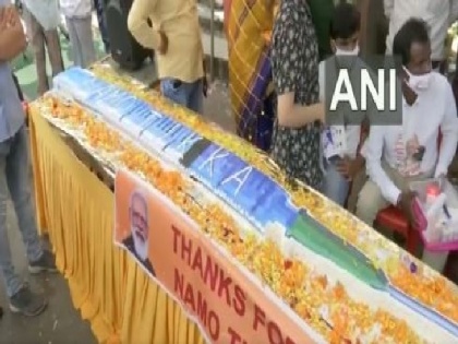 PM Modi's birthday: BJP workers cut 71-feet-long syringe-shaped cake in MP | PM Modi's birthday: BJP workers cut 71-feet-long syringe-shaped cake in MP