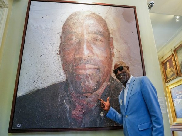 Vivian Richards poses with his portrait at Lord’s during England vs West Indies first Test