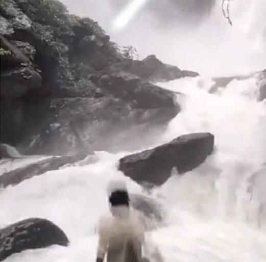 Youth watching Karnataka waterfall slips from rock into water, search
