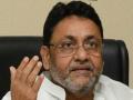 Is there a fixed match between AIMIM, BJP for making communal remarks, questions Nawab Malik - Hindi News | Is there a fixed match between AIMIM, BJP for making communal remarks, questions Nawab Malik | Latest politics News at Lokmattimes.com