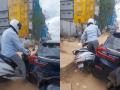 Watch: Scooter Rider Crashes Into Car Near Footpath in Bengaluru, Owner’s Calm Reaction Goes Viral - Hindi News | Watch: Scooter Rider Crashes Into Car Near Footpath in Bengaluru, Owner’s Calm Reaction Goes Viral | Latest social-viral News at Lokmattimes.com