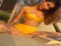 Bride to be Mouni Roy flaunts her curves in yellow swimwear - Hindi News | Bride to be Mouni Roy flaunts her curves in yellow swimwear | Latest entertainment News at Lokmattimes.com
