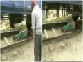 Watch Video! Woman lies down on railway track after she gets trapped under moving train - Hindi News | Watch Video! Woman lies down on railway track after she gets trapped under moving train | Latest national News at Lokmattimes.com