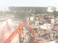Ahmedabad: AMC Demolishes 29 Houses Near Narendra Modi Stadium Ahead of Commonwealth Games - Hindi News | Ahmedabad: AMC Demolishes 29 Houses Near Narendra Modi Stadium Ahead of Commonwealth Games | Latest national News at Lokmattimes.com