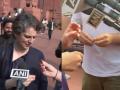 'Have a sweet': Rahul Gandhi Offers Toffee to Priyanka Gandhi Vadra As She Speaks About Parliament Showdown (Watch Video) - Hindi News | 'Have a sweet': Rahul Gandhi Offers Toffee to Priyanka Gandhi Vadra As She Speaks About Parliament Showdown (Watch Video) | Latest national News at Lokmattimes.com