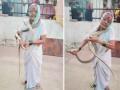 Watch: Elderly Woman Fearlessly Catches 8-Foot-Long Snake With Bare Hands, Video Goes Viral - Hindi News | Watch: Elderly Woman Fearlessly Catches 8-Foot-Long Snake With Bare Hands, Video Goes Viral | Latest social-viral News at Lokmattimes.com