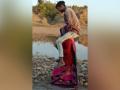 Watch Video! MP: Tribal woman forced to walk with in-laws on shoulders - Hindi News | Watch Video! MP: Tribal woman forced to walk with in-laws on shoulders | Latest national News at Lokmattimes.com