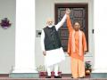 UP Assembly Elections 2022: Yogi gives the sign of victory by raising hands with PM Modi - Hindi News | UP Assembly Elections 2022: Yogi gives the sign of victory by raising hands with PM Modi | Latest politics News at Lokmattimes.com