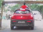 Bengaluru Viral Video: Boy Hit by Overhead Barrier While Standing Through Sunroof in Moving SUV (WATCH)