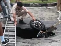 Chandigarh: Biker Falls Into Pit As Road Caves In After Heavy Rain; Video Goes Viral - News | Chandigarh: Biker Falls Into Pit As Road Caves In After Heavy Rain; Video Goes Viral | Latest national News at Lokmattimes.com