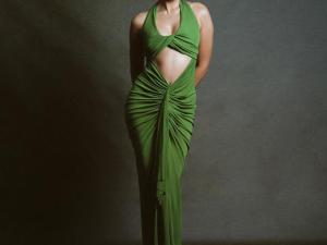 Shanaya Kapoor brings out the old-money vibe in a dramatic green outfit featuring a wrapped effect around the neckline and elevated, gathered pleats around the waistline. The actress lets the outfit steal the show as she keeps her hair in a smooth bun and layers her look with minimal jewellery.