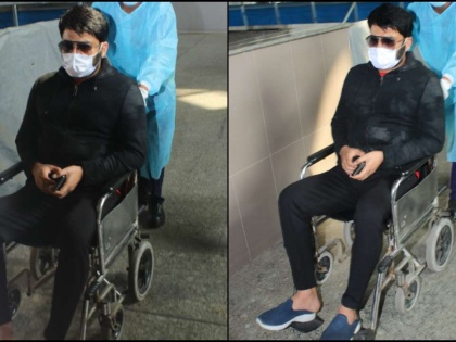 Kapil Sharma seen at airport in a wheel chair, fumes at photographers for clicking pics | Kapil Sharma seen at airport in a wheel chair, fumes at photographers for clicking pics
