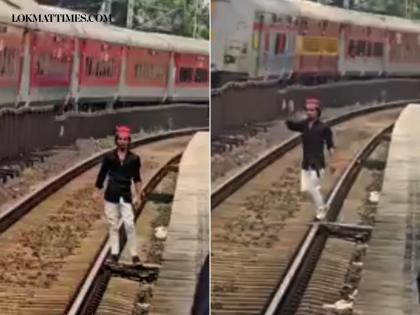 Viral Video Shocks Mumbai: Man Seen ‘Aura Farming’ on Local Train Tracks, Passengers Pull Him to Safety in Bhayander | Viral Video Shocks Mumbai: Man Seen ‘Aura Farming’ on Local Train Tracks, Passengers Pull Him to Safety in Bhayander