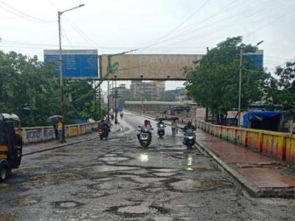 Thane: Ulhasnagar's Chhatrapati Shahu Maharaj flyover riddled with potholes, road repairs exist only on paper | Thane: Ulhasnagar's Chhatrapati Shahu Maharaj flyover riddled with potholes, road repairs exist only on paper Thane: Ulhasnagar's Chhatrapati Shahu Maharaj flyover riddled with potholes, road repairs exist only on paper | Thane: Ulhasnagar's Chhatrapati Shahu Maharaj flyover riddled with potholes, road repairs exist only on paper