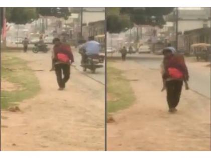 Video of man carrying dead body of daughter on shoulders goes viral, probe ordered | Video of man carrying dead body of daughter on shoulders goes viral, probe ordered