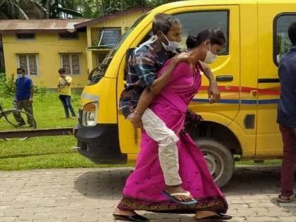 Woman carries covid positive father-in-law to hospital on her back | Woman carries covid positive father-in-law to hospital on her back Woman carries covid positive father-in-law to hospital on her back | Woman carries covid positive father-in-law to hospital on her back