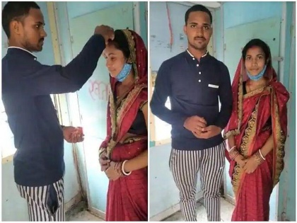 Man marries married woman in front of toilet in a moving train, photo goes viral | Man marries married woman in front of toilet in a moving train, photo goes viral