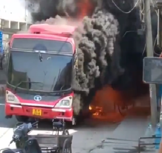 Watch! DTC bus catches fire, engulfs two shops; no injuries reported | Watch! DTC bus catches fire, engulfs two shops; no injuries reported