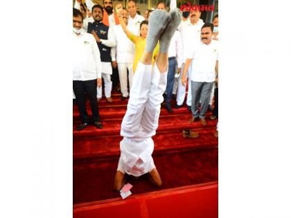 NCP MLA performs 'Shirshasan' to protest against Governor's comments on Shivaji's guru | NCP MLA performs 'Shirshasan' to protest against Governor's comments on Shivaji's guru
