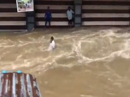 Shocking! Man washed away by strong flood waters in Hyderabad, as video goes viral | Shocking! Man washed away by strong flood waters in Hyderabad, as video goes viral