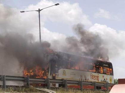 ST bus engulfed in flames on Pune-Bangalore highway | ST bus engulfed in flames on Pune-Bangalore highway ST bus engulfed in flames on Pune-Bangalore highway | ST bus engulfed in flames on Pune-Bangalore highway