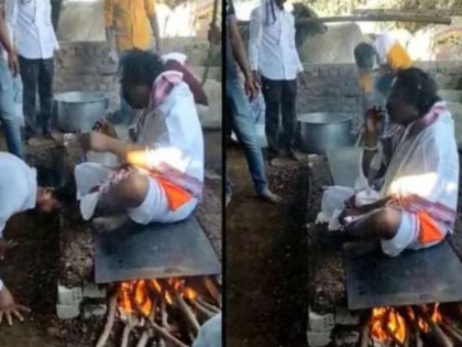 Watch: Video of man sitting on hot frying pan goes viral, sparks debate on superstition | Watch: Video of man sitting on hot frying pan goes viral, sparks debate on superstition