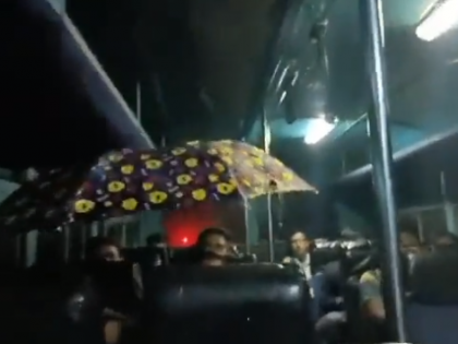 Watch: Passenger opens umbrella inside ST bus due to roof leakage | Watch: Passenger opens umbrella inside ST bus due to roof leakage