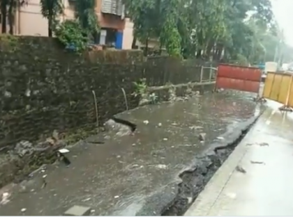 Watch: Rain-triggered road cave-in near IT Park in Goregaon causes traffic disruption | Watch: Rain-triggered road cave-in near IT Park in Goregaon causes traffic disruption