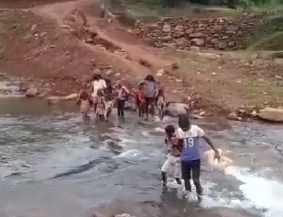 Watch: Children wade through river to reach school in Pune's Ghisar village | Watch: Children wade through river to reach school in Pune's Ghisar village